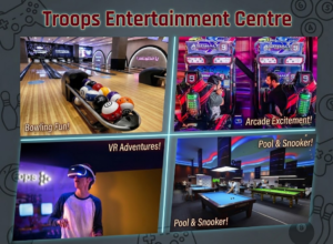 Four-panel graphic 'Troops Entertainment Centre' featuring bowling lanes, racing arcade games, a VR gaming headset, and pool tables, KhaleejFusion.