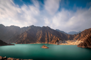 Turquoise lake and rugged mountains at Hatta Dam, KhaleejFusion